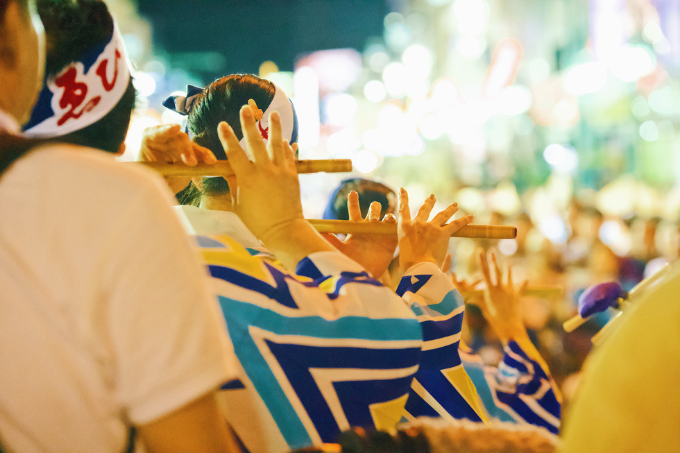 People in Kimono Paying Bamboo Flute in a Festival